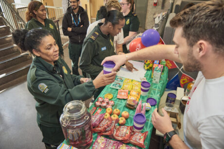 Curtis handing out snacks and coffee at the wellbeing café to staff and paramedics