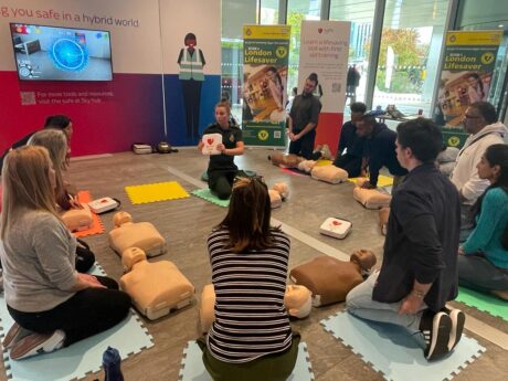 A member of our London Lifesaver team giving CPR training to Sky staff