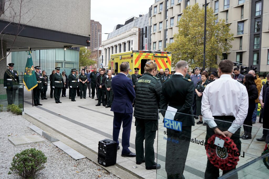 London Ambulance staff gather on Remembrance Sunday 2022 in the ceremonial garden to pay their respects to all service people who have lost their lives or been injured in conflict. 