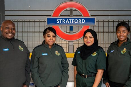 Paramedic Greg, 111 call handler Shanice, mental health nurse Tahmina and 111 call handler Sapphire stand in front of the Stratford underground sign.