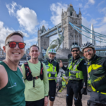 An #OutrunAnAmbulance fundraiser poses for a picture after completing the challenge, in front of Tower Bridge in London.