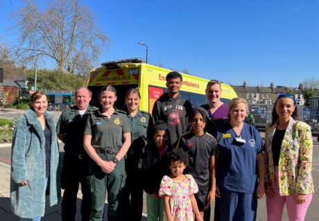 Joel (middle) with LAS and St George's medics and family