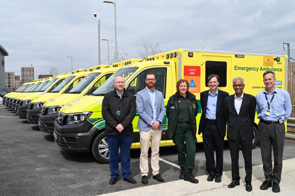 A photo of our new ambulances at Rainham, the following people in the forefront: Development Projects Officer Paul Henry, Fleet Modernisation Manager Chris Rutherford, Paramedic Dawn Baxter , James Cook (NHS England), Chief Financial Officer Rakesh Patel and Chief Executive Daniel Elkeles.