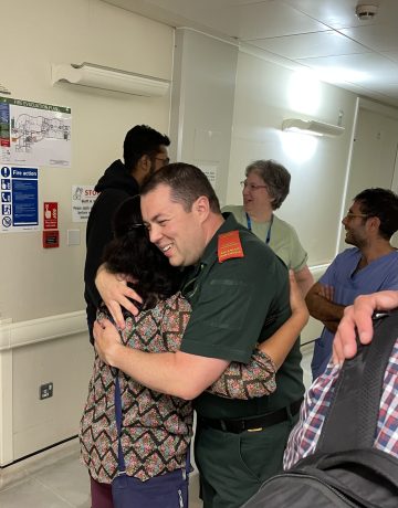 Advanced Paramedic Nick gets a hug from Atul's grateful mum