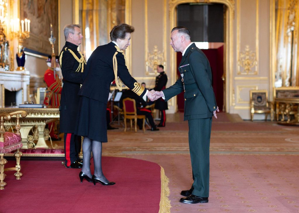 Nigel Flanagan receives the King's Ambulance Medal from Anne, Princess Royal. 