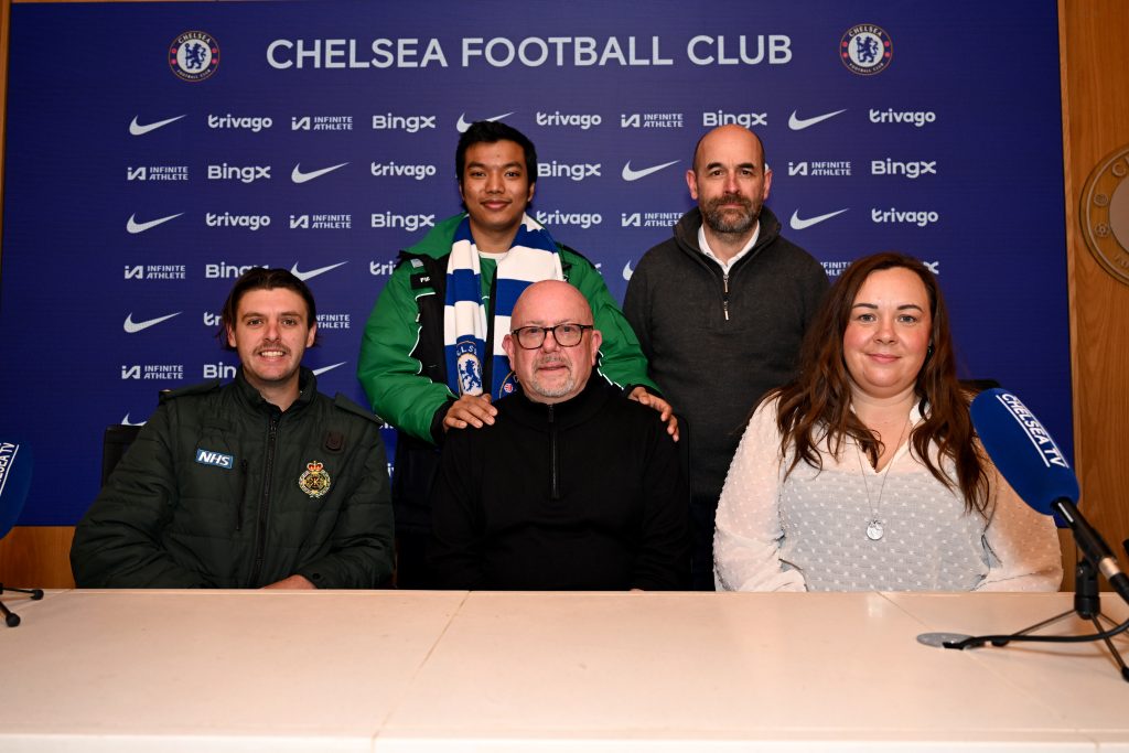 A picture of paramedic Billy Britton at a reunion with patient Paul Archer, in the Chelsea Football Club press conference room. 