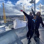 Image shows Shonagh and her two children Kiki and Aaliyah at the top of the O2 dome with the sun shining.