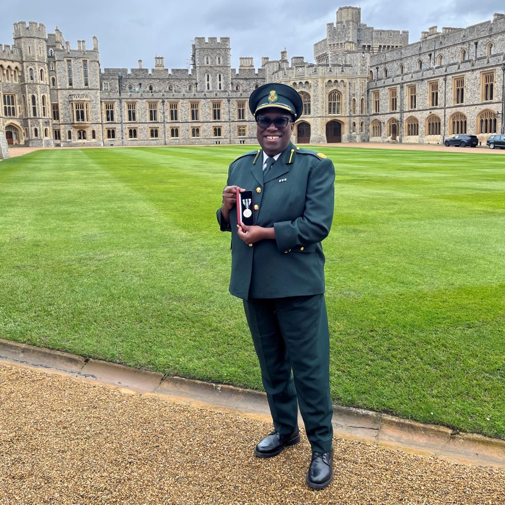 Cathy-Anne Burchett KAM receiving her medal at Windsor Castle. 