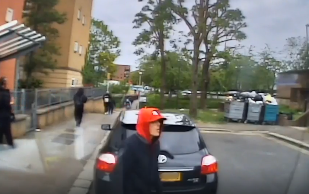 A CCTV screenshot of a thief before they break into an ambulance and steal paramedics' belongings.