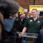 James Johnson shares a media update to press at a Hatzola Ambulance station.