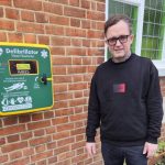 Reverend Stephen Maclean stood by a public-access defibrillator.